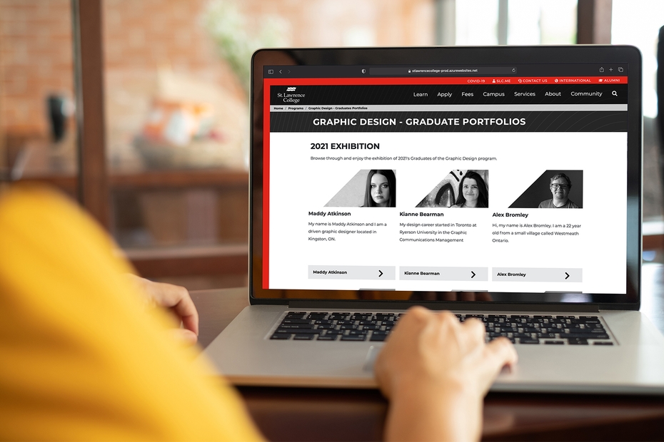 Someone browses the Graphic Design student portfolio webpage on a laptop